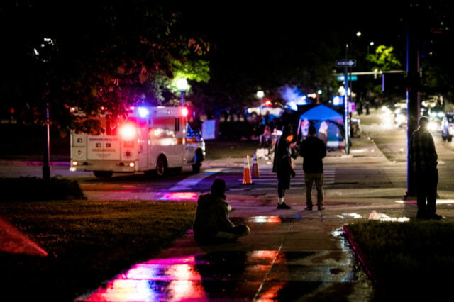 Protest site near capitol after dark.