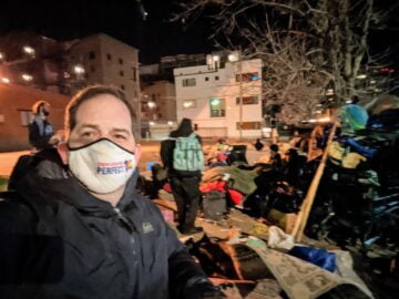 Photo of Chris next to D10 encampment
