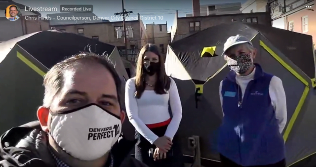 chris hinds dr Kathleen Van Voorhis and Kathleen Cronan, all wearing masks, take a selfie in front of two tents at the first Safe Outdoor Space to open in Denver