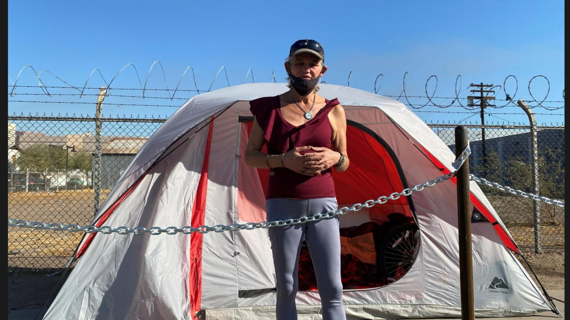 Photo of woman in front of tent