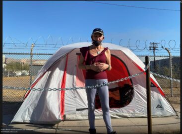 Photo of woman in front of tent