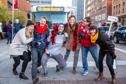 Denver Streets Partnership advocates in front of the RTD 10 bus